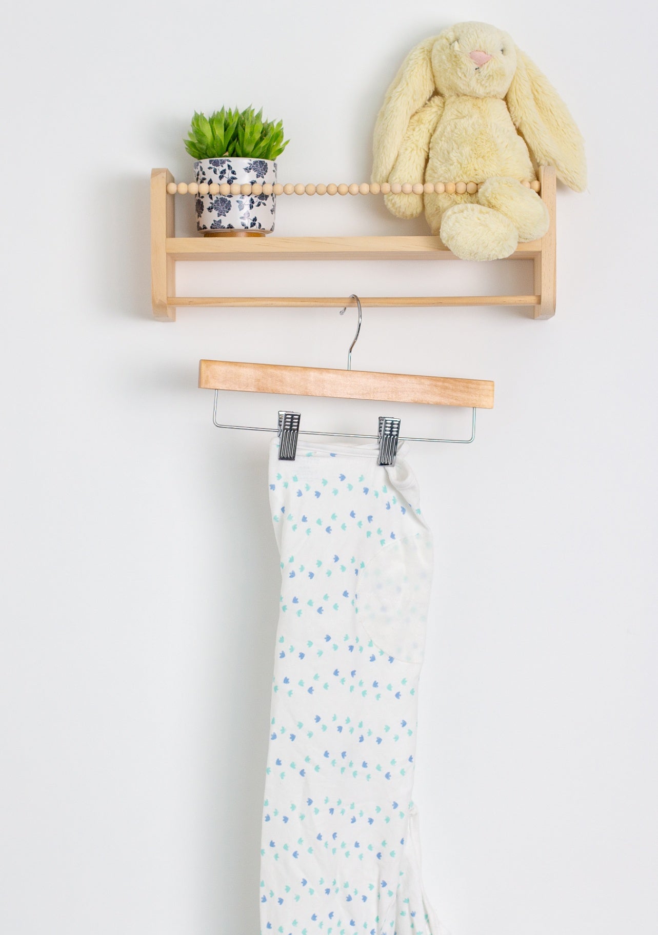 Aden and Anais 4-6M White with blue and green accents swaddle